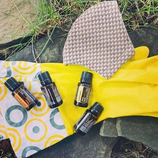 essential oil bottles with gloves and mask